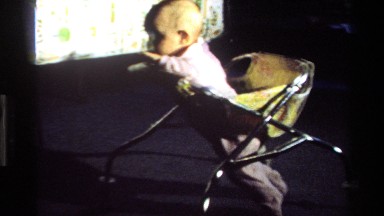 1977: infant in walker moving forward clumsily CALIFORNIA