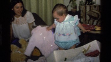 1977: baby video opening her own presents, she looks excited about her new pink
