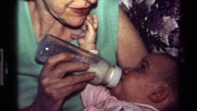 1977: Grandmother Feeds Baby with Bottle in California