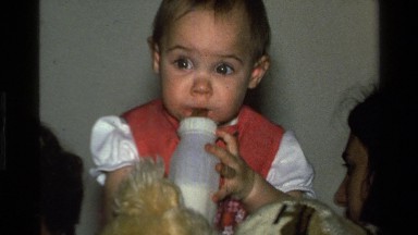 1977: beautiful little girl drinking her bottle CALIFORNIA