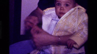 1977: mom dresses her child warm and let the child crawl on the floor.