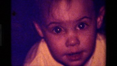 1979: a little boy crawling looks at the camera and stands up CALIFORNIA