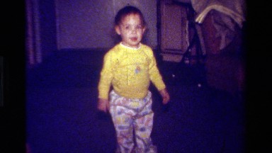 1979: little kid putting hand on head, then stopping to smile at the camera