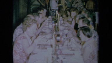 1961: A Large Group of Family and Friends Eating Dinner at a Table in California