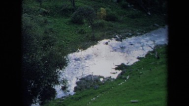 1969: peaceful green grass valley water flow CALIFORNIA