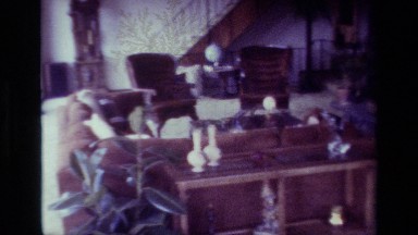 1977: A Large Living Room Filled with Mid-Century Furniture and Glass Panes