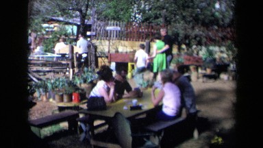 1969: Group of People Enjoying Picnic and Food in California