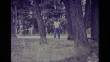 1977: Man in White Shirt Walking Outside Big Brick House Big Bear California