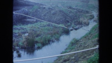 1971: A Large Area Full of Water Covered with Many Trees on Its Sides Maine