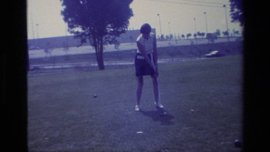 1977: a woman striking a golf ball with a golf club LAGUNA BEACH CALIFORNIA