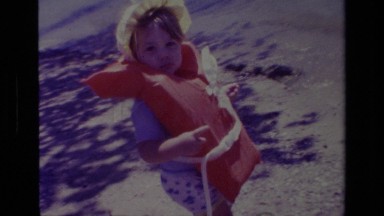 1978: little girl approaching beach in a life vest CANYON LAKE CALIFORNIA