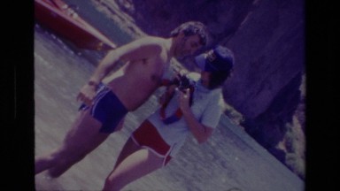 1978: Two Couples Standing in Water Posing for Photo at Canyon Lake