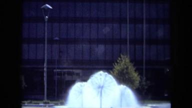 1969: Dandelion Sprinklers Outside Glass Building California