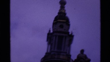 1969: A Historic London Cathedral with Cross at Pinnacle and Old Clock Tower