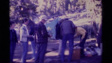 1975: a group of people at a campsite prepare a meal MINARET WILDERNESS