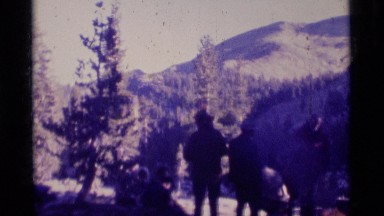1975: a panoramic view of a group of people that are outside together