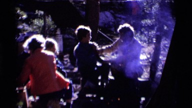 1975: boys being rough outside by a fire MINARET WILDERNESS CALIFORNIA