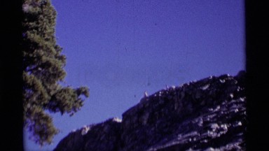 1975: men at high peak of cliff MINARET WILDERNESS CALIFORNIA