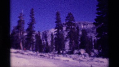 1975: backpackers camping in the wilderness surrounded by granite outcrops