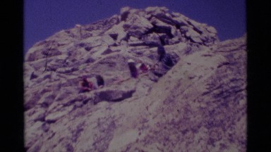 1975: a spectacular view of brave hikers on the top of an icy mountain