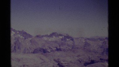 1975: a large area with lots of grass and a mountain around MINARET WILDERNESS