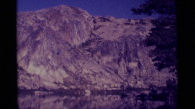 1975: mountain peaks in the distance with the lake in the foreground MINARET