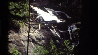 1972: rock wedge, boulder and manmade partition divide waterfall into smaller