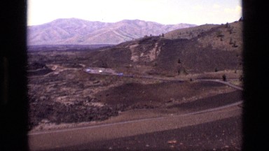1972: a top view of a busy road with many vehicles moving around IDAHO