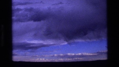 1972: heavy and thick clouds sit high in the dark blue sky IDAHO