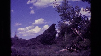 1972: a jagged rock formation at the edge of a forest IDAHO