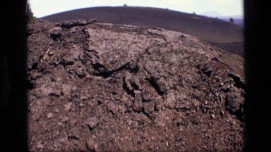 1972: a zooming in shot of a pile of dirt that moves in till the dirt clod