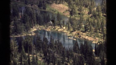 1972: a gorgeous view of the majestic mountains and forests. HOLLAND LAKE