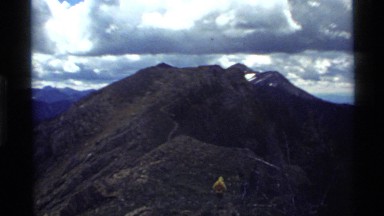 1972: several hikers walking to the top of a mountain