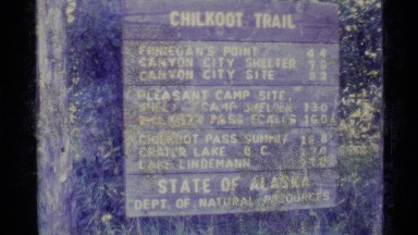 1977: an old sign for chilkoot trail in the state of alaska, usa ALASKA