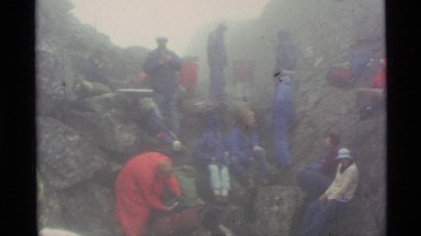 1977: a group of people enjoying their tour in the middle of mountain area