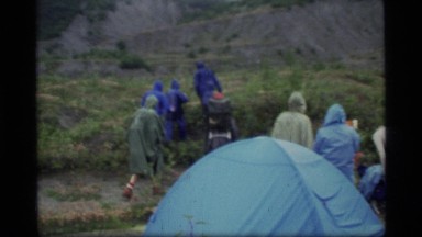 1977: a group of people going on a trekking expedition on a rainy morning