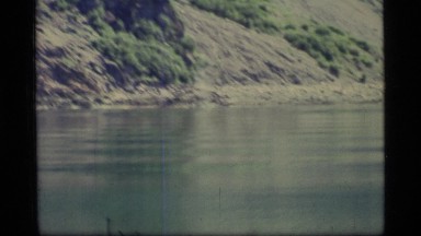 1977: shaking video of a body of water with raised land on the side GLACIER BAY