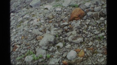 1977: zoom in of various and multi-colored rocks GLACIER BAY ALASKA