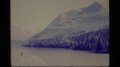 1977: a large area full of water covered with mountains on its sides ALASKA