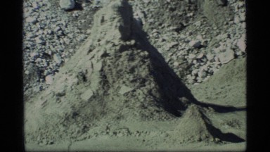 1977: a hiker walking with his backpack across a desolate spot GLACIER BAY