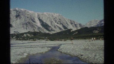 1977: water flows swiftly from a small stream into a river GLACIER BAY ALASKA