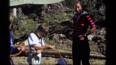 1977: boys with ropes that they are wrapping around themselves and trying to tie