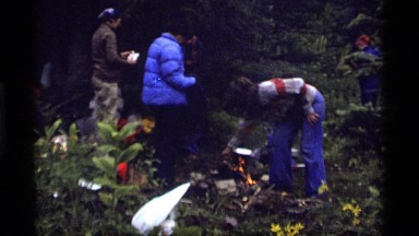 1977: group of humans outside cooking and camping SAPPHIRE LAKE MONTANA