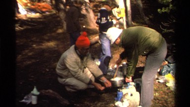 1978: stirring food in a pot on a campfire LAKE TAHOE CALIFORNIA