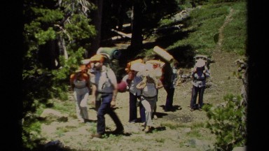 1978: people walking down a trail with camping gear on their back. LAKE TAHOE
