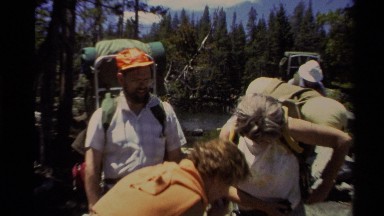 1978: a group of people strap on their backpacks as they prepare for a trek LAKE