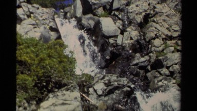 1978: Spurts of Water Flow Down a Rock Face on a Sunny Day Lake Tahoe California