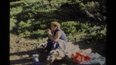 1978: man eat his breakfast in a forest,enjoying the nature LAKE TAHOE