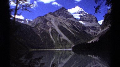 1979: the perfect mirror image of a snow capped peak seen in the lake below