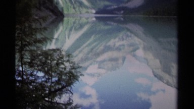 1979: beautiful mountains covered in snow reflected off the surface